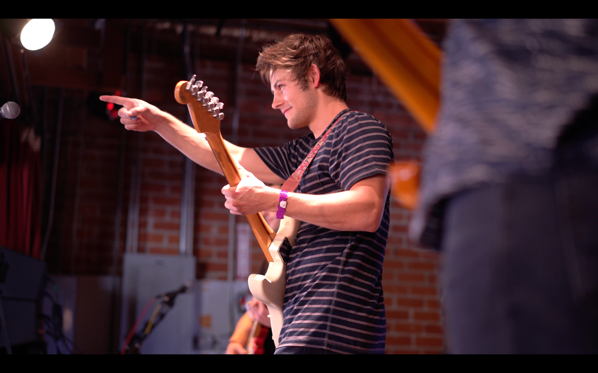 Pointing into the crowd while playing
