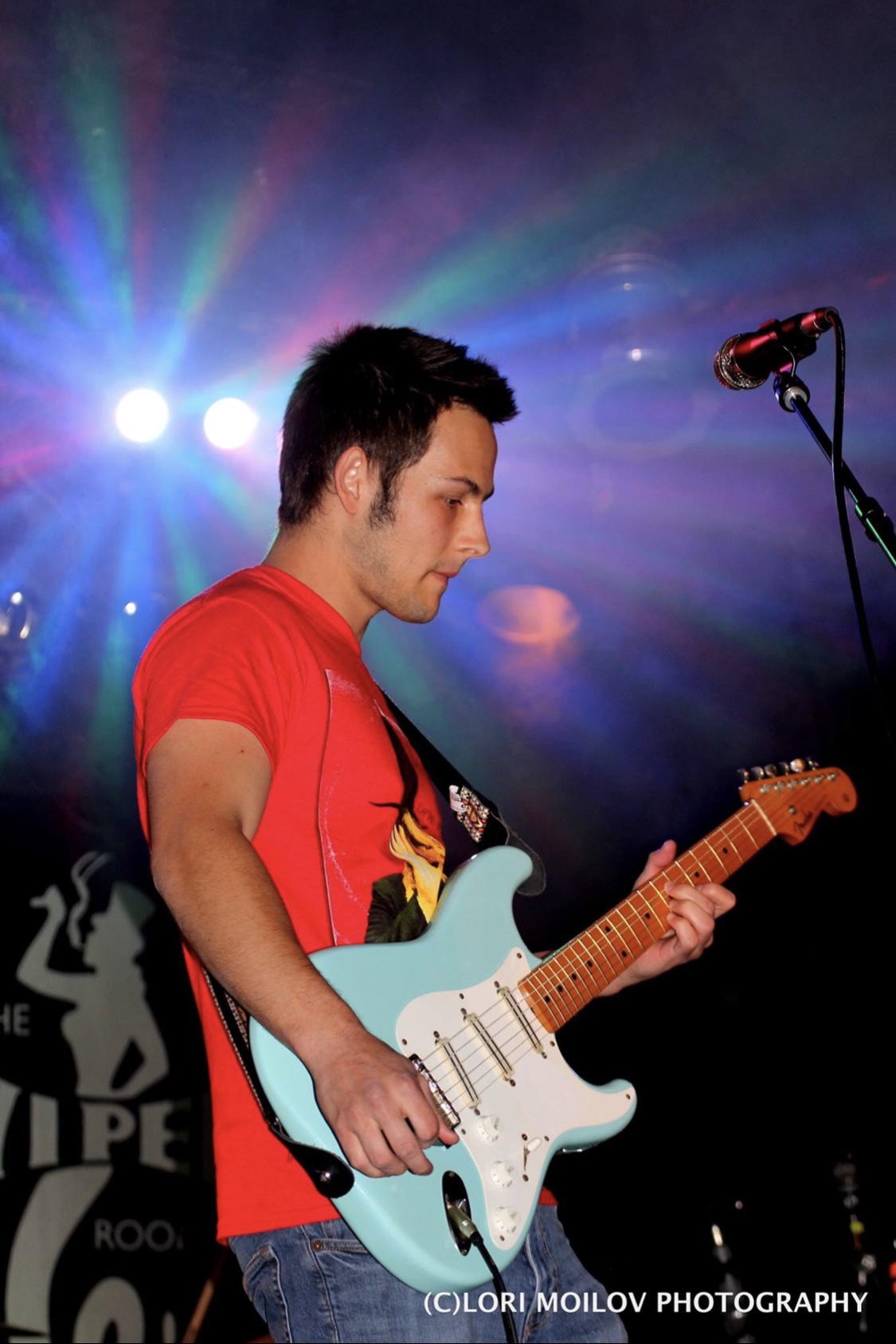 Performing with blue guitar